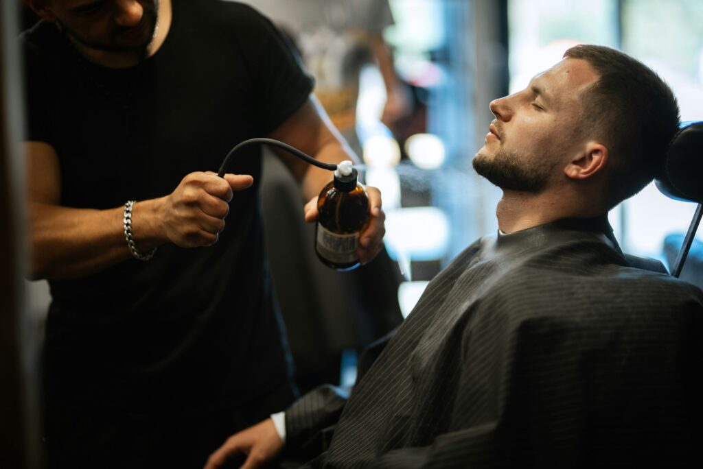 portrait of a young guy groom at the training camp in the barbershop